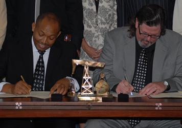 Michael W. Helvey signing with Tanzania